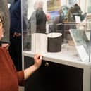 Carol Sinclair with a pair of sculptural vessels in porcelain ‘Inside Outside'.