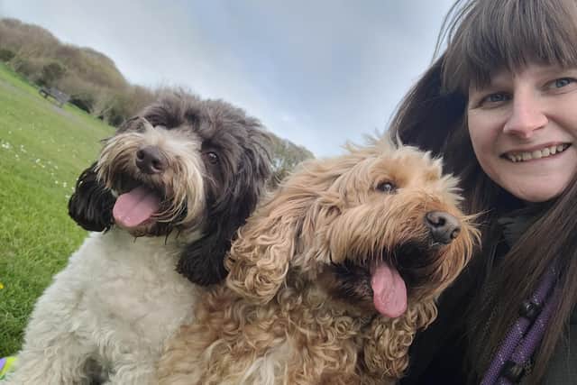 Arlene Millar is pictured with her cockapoos Henry and Cooper from whom she took the name of the company.