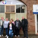 Graeme Dey (right) is pictured with staff during his visit.