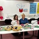 Pictured are, Kirsty Sutherland (left) and Victoria McQuillan, project delivery officer for the Scottish Libraries and Information Council (SLIC), who cut the ribbon to open the facility.