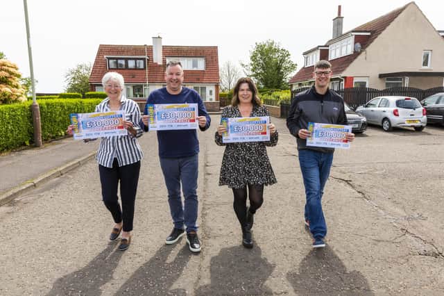 Pictured (from left) are People's Postcode Lottery winners Moira Thom, Graeme Carnegie, Chrstine Glass and Jamie Cooper