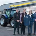 Gordon Cairns, (second left) welcomes Agricar Group to the sponsorship team with a top for Finance Director Wendy Smith, watched by Directors Mike Milne and Derek Johnston.