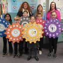 Head teacher Jennifer Garnes is pictured with staff and pupils and some of the Emotional Works materials used in classes.