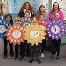 Head teacher Jennifer Garnes is pictured with staff and pupils and some of the Emotional Works materials used in classes.