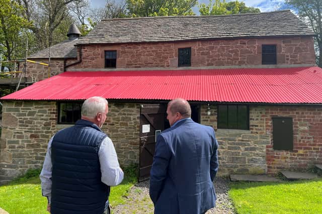 Mr Dey discussed the history of Barry Mill with its custodian Michael Metcalfe.