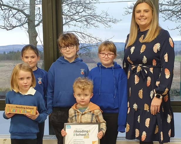 Airlie Primary School Reading School Committee - Back - Heather, Lochryn, teacher Mrs Sharpe. Front - Esmay, Aonghus