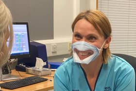 Ruth Edgar, Audiologist, wearing a transparent mask.